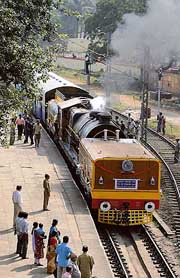 Visitors watch as a 1927 Beyer Garrat locomotive leaves the station for a heritage run from Shalimar station close to Kolkata on Friday. 