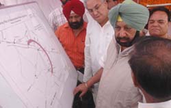 After laying the foundation stone of Rahon-Nawanshar bypass, Chief Minister Captain Amarider Singh discusses the project with Nawanshahr DC Krishan Kumar on Saturday. 