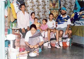 Babu Ram with his family (son Raj Kumar is with the racquet) and coach Gian Inder Singh