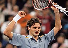 World number one Roger Federer of Switzerland celebrates after beating Rafael Nadal of Spain, at the Masters Cup in Shanghai
