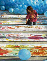 A child paints a flower on the worlds longest-ever painting, a Guinness Book record, made by children in Bucharest on Saturday.