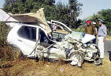 Mr Rachhpal Singh, SHO, Dehlon, inspects the Indica car that had collided with a truck at Kaind Bridge near Ahmedgarh on Saturday evening.