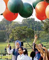 Prime Minister Manmohan Singh and UPA chairperson Sonia Gandhi release balloons at Shakti Sthal after paying floral tributes to former Prime Minister Indira Gandhi on her 89th birth anniversary in New Delhi on Sunday. 