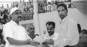 Prem Kumar Jangra (right), who has been surviving solely on milk since birth, being honoured by former Hansi SDM Satish Kumar Jain