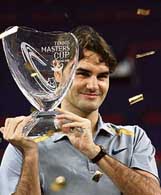 World No. 1 Roger Federer of Switzerland holds the trophy after winning the $4.45 million Tennis Masters Cup tournament in Shanghai on Sunday. Federer defeated James Blake of the USA 6-0, 6-3, 6-4 in the final. 