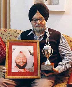 Mr Gurpratap Singh Sahi with a photo of his late son Samarvir and a replica of the Samarvir Sahi Challenge Trophy at his residence in Chandigarh on Sunday. 