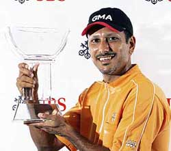 Jeev Milkha Singh with the Asian Tours UBS Order of Merit trophy at the Hong Kong Golf Club on Sunday. 