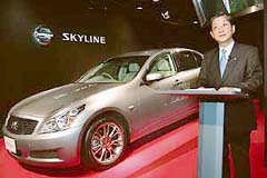 Nissan Motor Co Chief Operating Officer Toshiyuki Shiga unveils the 12th generation Skyline, featuring all-new exterior and interior designs, in Tokyo