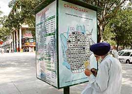 A villager tries to make sense of a recently installed road map in Sector 17 of Chandigarh.