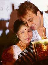 Sanjay Dutt greets playback singer Asha Bhosle at the music launch of the album Asha and Friends" in Mumbai on Monday. Dutt has rendered his voice in one of the tracks in the album. 
