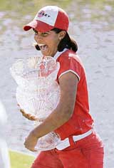 Paraguays Julieta Granada clutches her trophy after winning the LPGA ADT Championship at the Trump International Golf Club in West Palm Beach, Florida, on Sunday