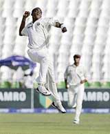 Jerome Taylor of the West Indies celebrates the dismissal of Pakistans Inzamam-ul-Haq on the second day of the second Test at Multan on Monday