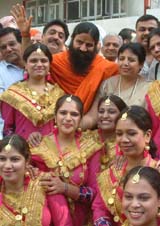 Yoga guru Swami Ramdev interacts with girls in Amritsar
