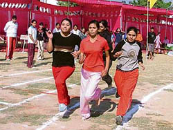 Girls run the 400-m race on the opening day of the VIth annual inter-house athletics meet of BCM Arya Model Senior Secondary School, Ludhiana, on Tuesday.