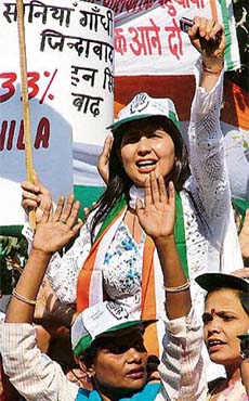 Mahila Congress activists raise slogans in favour of 33 per cent reservation for women during a rally
