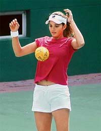 Sania Mirza practices with a ball at the Lal Bahadhur Indoor Tennis Stadium in Hyderabad