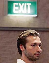 Australias world and Olympic swimming champion Ian Thorpe (24) arrives at a media conference to announce his retirement in Sydney