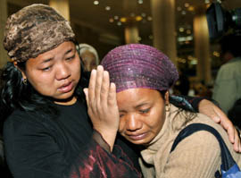 A newly arrived Jewish immigrant from India cries upon arrival at Ben Gurion International Airport near Tel Aviv on Tuesday. The immigrants, who arrived in Israel on Tuesday, members of the Bnei Menashe community in Indias remote north-eastern states of Mizoram and Manipur, who trace their lineage to one of the 10 lost tribes of Israel exiled by an Assyrian empire 27 centuries ago.