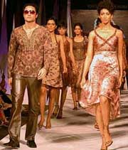 Models wear designers clothes during a fashion show held at a hotel in Chandigarh, on Wednesday. 