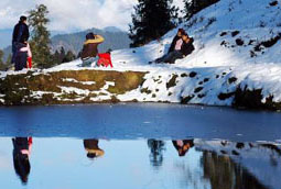 Tourists enjoy the seasons first snowfall in Narkanda on Wednesday.