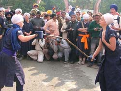 Students of the Miri Piri Academy perform gatka in the procession to mark the start of the Amritsar Heritage Festival on Wednesday. 