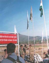 A hoarding carries slogan of friendship between India and Pakistan at Chakan-da-Bagh village on the LoC in Poonch