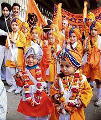 Children dressed in traditional ‘Khalsa’ attire take part in the nagar kirtan taken out on the eve of martyrdom day of Guru Tegh Bahadur in Ludhiana on Wednesday.