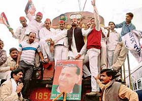 Samajwadi Party activists block a train on Sangharsh Diwas, the birthday of U.P. Chief Minister Mulayam Singh Yadav, at Allahabad railway station