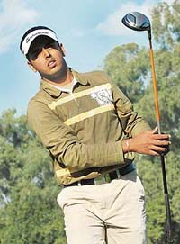 Anirban Lahiri watches his shot during the second day
