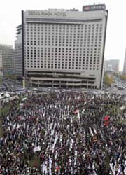 Protesters chant slogans at a strike rally in Seoul