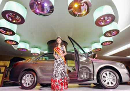 Miss Vietnam Mai Phuong Thuy stands next to a Toyota's all-new 2007 Camry 2.4 G at its launch in Hanoi 