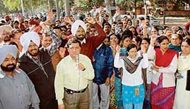 Members of the All-India Employees Provident Fund Staff Federation stage a protest at Sector 17, Chandigarh