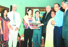 Rashmi Sharma receives the award from Justice R. L. Anand, Chairman, Punjab State Human Rights Commission