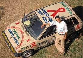 Gaurav Gaur, Commonwealth Youth Ambassador, with his car, painted with slogans on AIDS awareness, that was flagged off by the Director of Youth Affairs Division, Commonwealth Secretariat, in Chandigarh on Thursday