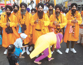 Sikh devotees pay obeisance to Panj Payre during a procession taken out to mark the Martyrdom Day of Guru Teg Bahadur in the Capital on Friday. 