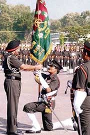 Chief of Army Staff Gen J.J. Singh presents the Presidential Colours to Lt Col R.K. Pathak of Pioneer Corps in Bangalore on Friday.