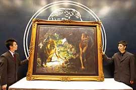 Security personnel stand guard next to the oil painting "Slave and Lion" by Chinese artist Xu Beihong at a Christie's auction in Hong Kong on Sunday. The artwork has smashed the record of a Chinese oil painting selling for HK $53.9 million ($6.9 million). 