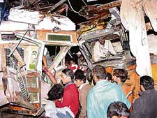 One of the drivers being pulled out of the mangled remains of a truck, while the other awaits help following a head-on collision between two trucks on the Ramgarh-Barwala highway, near Panchkula, on Saturday night.