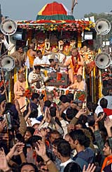 Devotees pull a chariot of Lord Jagannath, his brother Balabhadra and sister Subhadra during the annual Jagannath Rath Yatra Festival in Amritsar on Saturday.