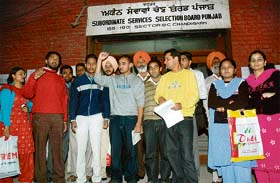 Candidates outside the office of the Subordinate Services Selection Board, Punjab, protest against the inability of the board to put up complete lists outside their office in Chandigarh
