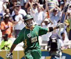 South Africas Justin Kemp celebrates after hitting a century during the third one-dayer against India in Cape Town on Sunday.