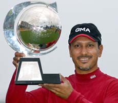 Jeev Milkha Singh holds the trophy after winning the $1.2 million Casio World Open golf tournament at the Kuroshio Country Club in Geisai village in Kochi prefecture, western Japan, on Sunday.