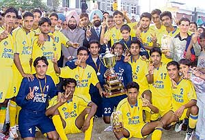 The victorious Punjab team with the trophy after defeating Uttar Pradesh in the final of the 43rd Junior National Football Championship (North Zone) at Malerkotla on Sunday.
