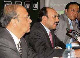 Mr Ajay S. Shriram (centre) and Mr Adesh Gupta (right) give details of Agro-Tech 2006 to mediapersons in Chandigarh, on Thursday. 