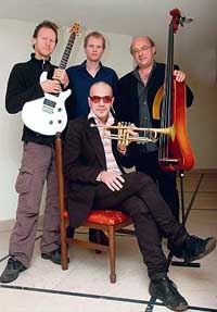 Swiss jazz musician Martin Dahanukar (seated) poses with the members of his band at PU's Law auditorium in Chandigarh on Thursday.