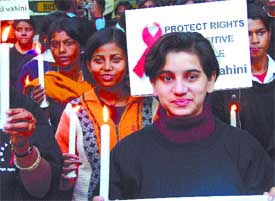 Members of Shakti Vahini, an NGO, participating in a candle march on the eve of World AIDS Day, at Jantar Mantar in the Capital on Thursday