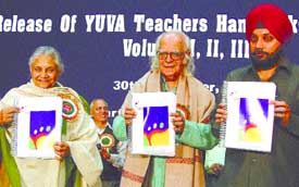 Delhi Chief Minister Sheila Dikshit along with Professor Yashpal and Education Minister Arvinder Singh Lovely releasing Yuva Teachers Handbooks at Talkatora Stadium on Thursday