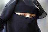 A protester demonstrates against the ban on Muslim women wearing the burqa