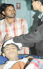 A boy who was injured in collapse of a two-storeyed building at Uttam Nagar undergoing treatment in a hospital.