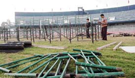 Damage being caused to the football ground in Guru Nanak Stadium, Ludhiana, as poles are installed for a function. 